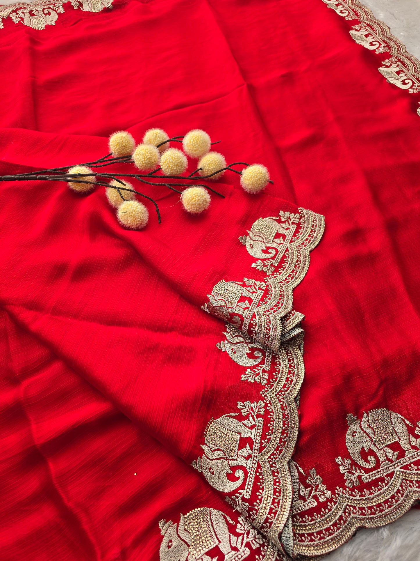 Red Georgette Saree with Zari Elephant Motif Border and Sequin Butti Work