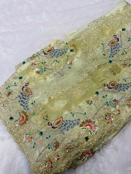 Pastel Pistachio Organza Embroidered Saree with Peacock Motifs & Heavy Zari Border